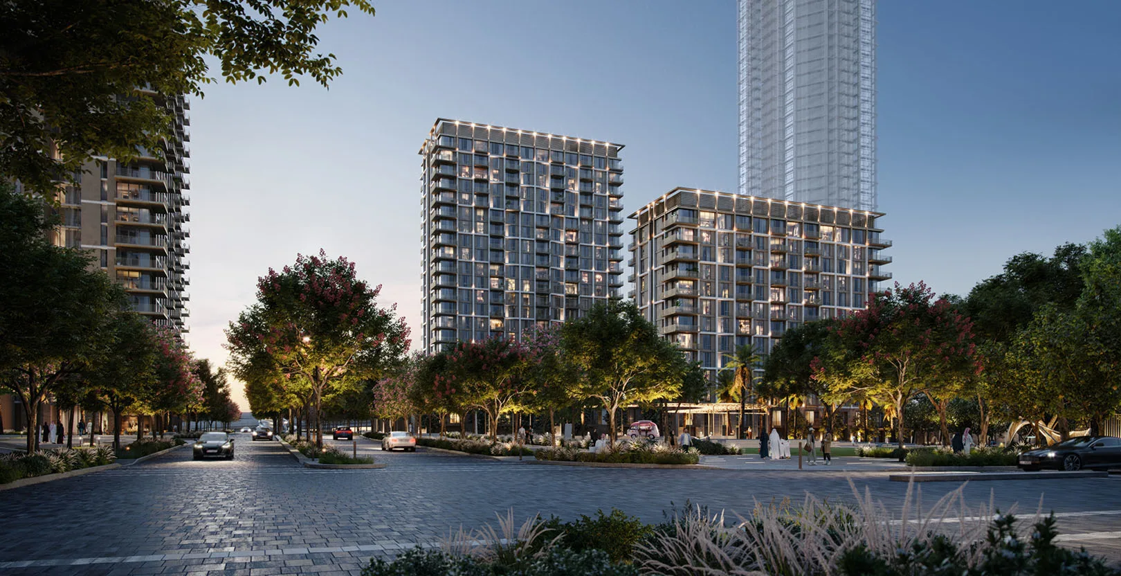 Aeon at Dubai Creek Harbour — evening official still of the two mid-rise towers on a cobbled street