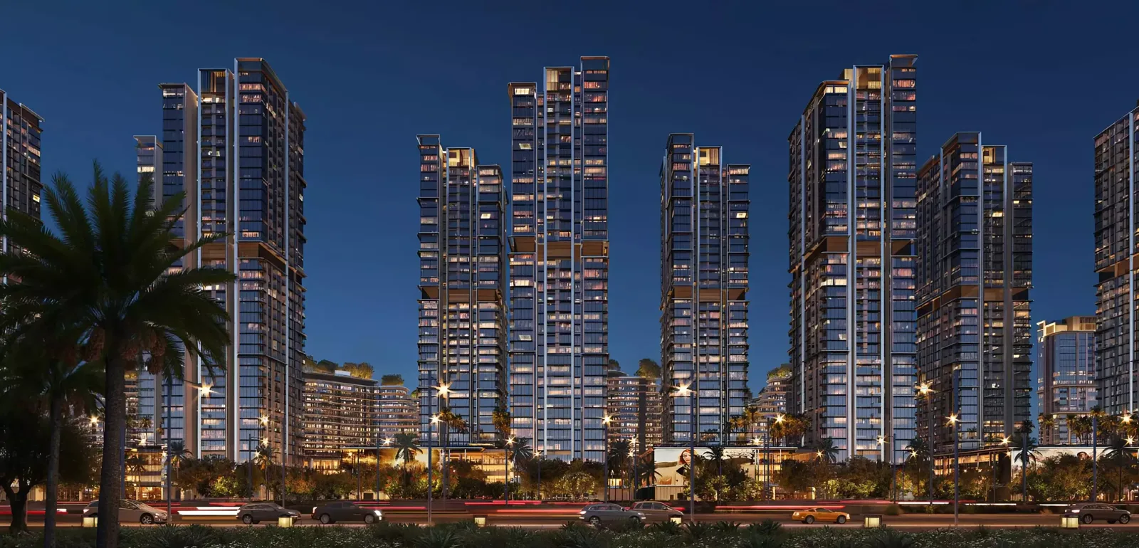 Leftover Property Finder Altura night skyline — a cluster of high-rises wrapping the Waada apartment campus
