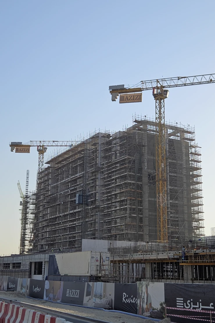 Azizi Riviera 55 — October 2024 construction photo with Azizi cranes and Riviera hoarding