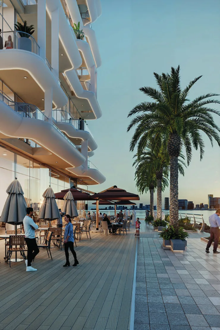 Azizi Wasel — marketing promenade CGI with cafe tables, palms and the white balcony stack