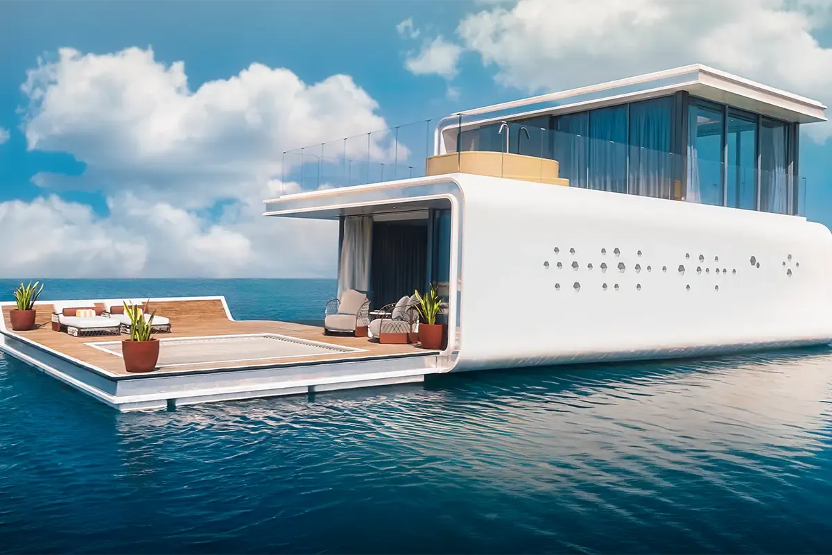Floating Residences by Buddha-Bar — white three-level overwater villa with timber deck, rooftop jacuzzi and hexagonal portholes