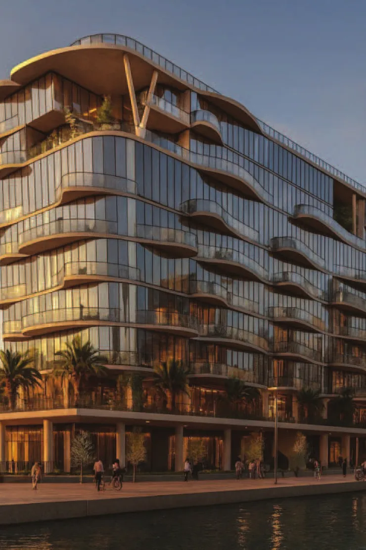 Coralis Grand Residences — Propsearch dusk render of the same wavy facade on the canal promenade