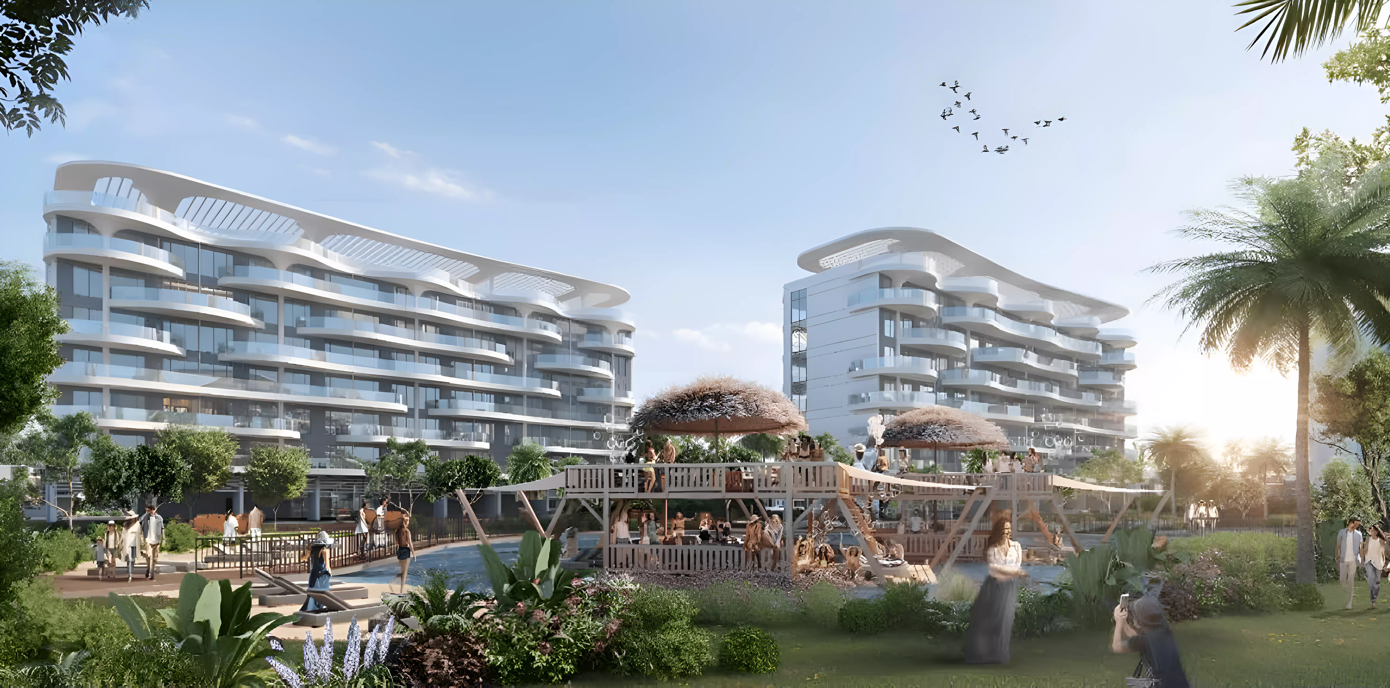 Damac Lagoon Views Andalucia — marketing exterior of twin mid-rise blocks with playground amenity in the foreground
