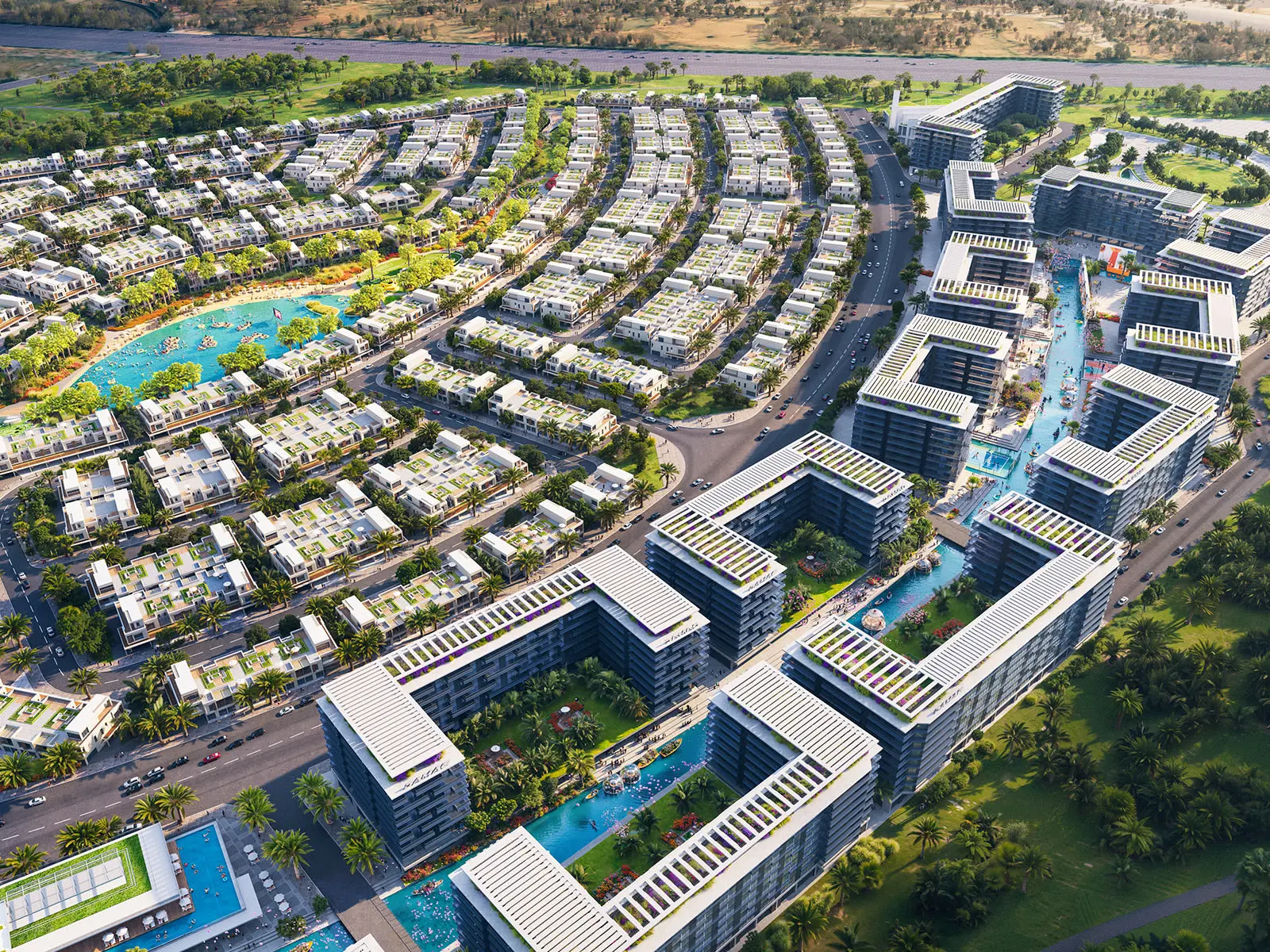 Official DAMAC Riverside aerial — villa pockets and lagoon on the left, Riverside Views mid-rises on the canal to the right