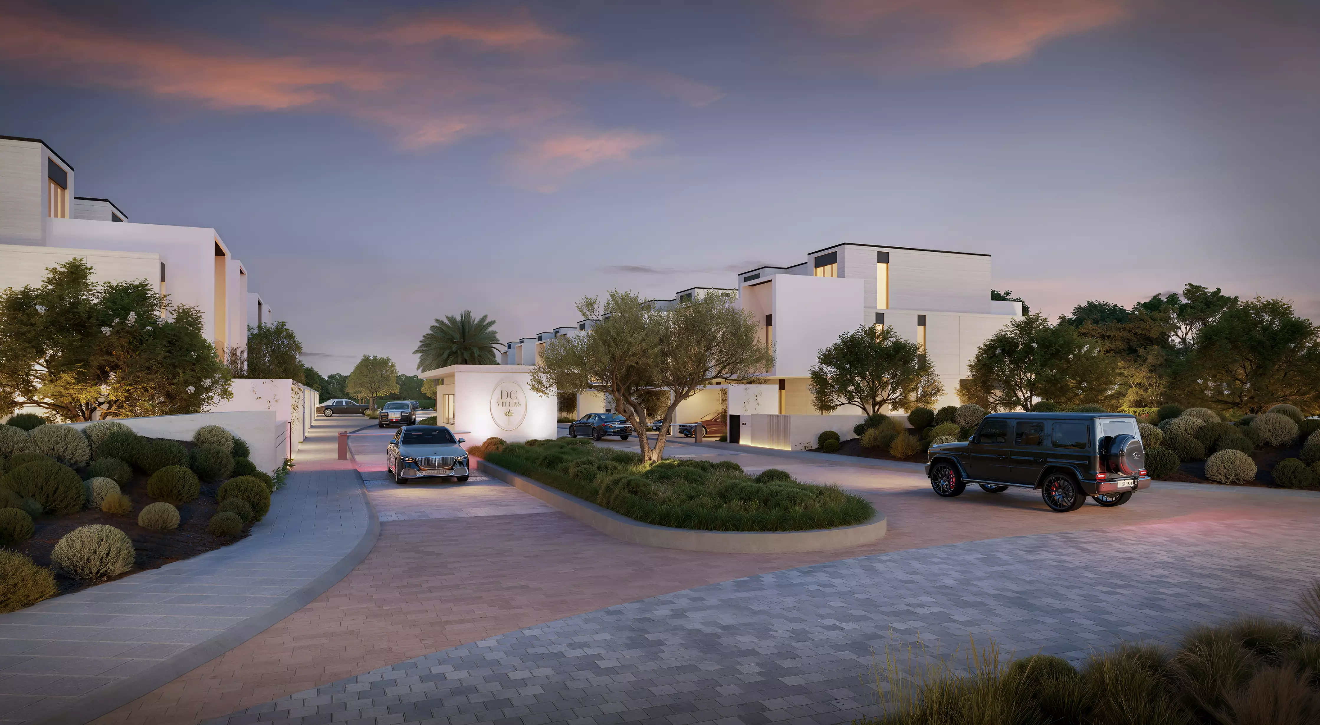D-Villas — DG Villas branded community entrance at dusk