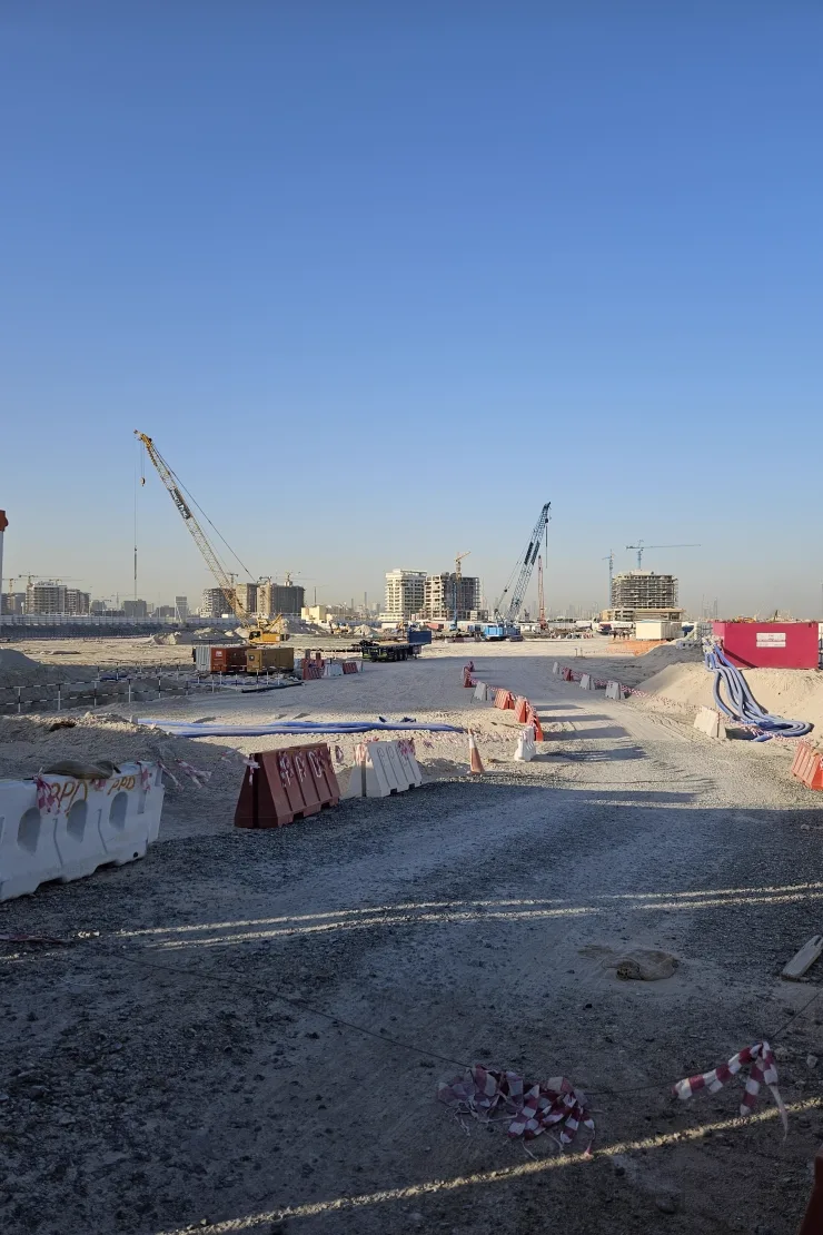 Propsearch Ellington Sands 2 construction photo, 24 May 2026 — open plot and early works; towers in the haze are neighbours