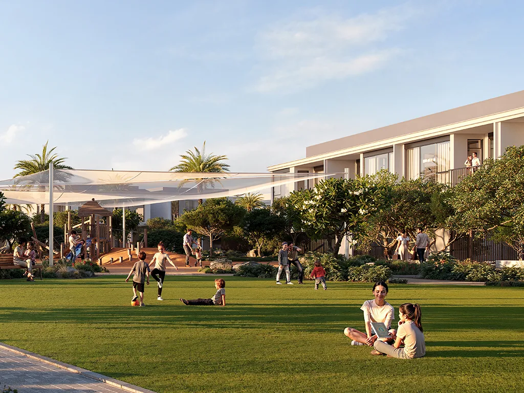Greenspoint Emaar South — lawn and townhouse façades marketing still