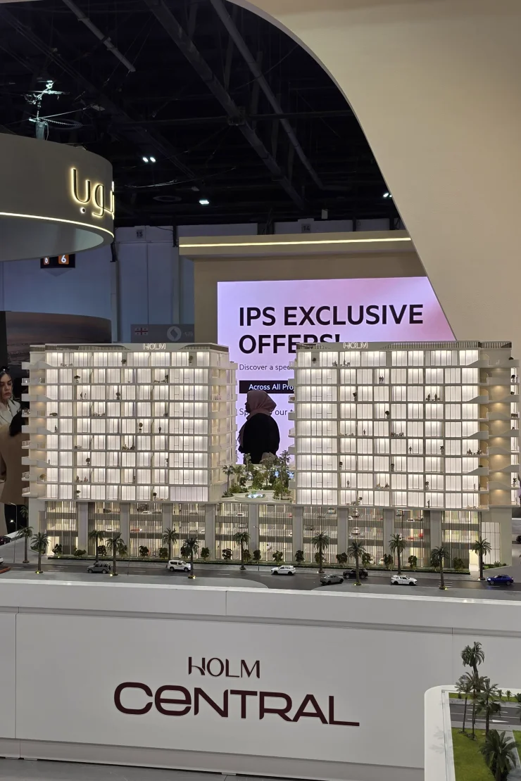 Holm Central IPS 2026 booth — two-tower model on a HOLM CENTRAL plinth