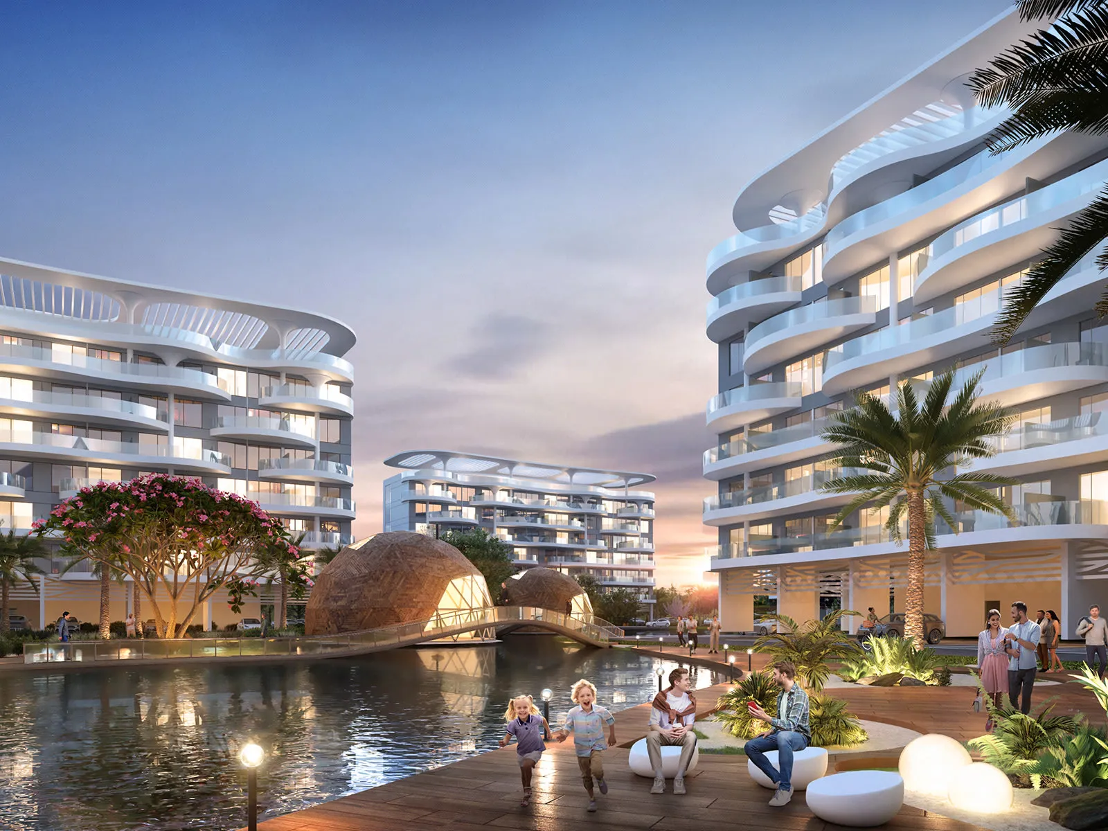 Lagoon Views 12 at DAMAC Lagoons — official plaza between curved apartment blocks with a floating bridge over the lagoon