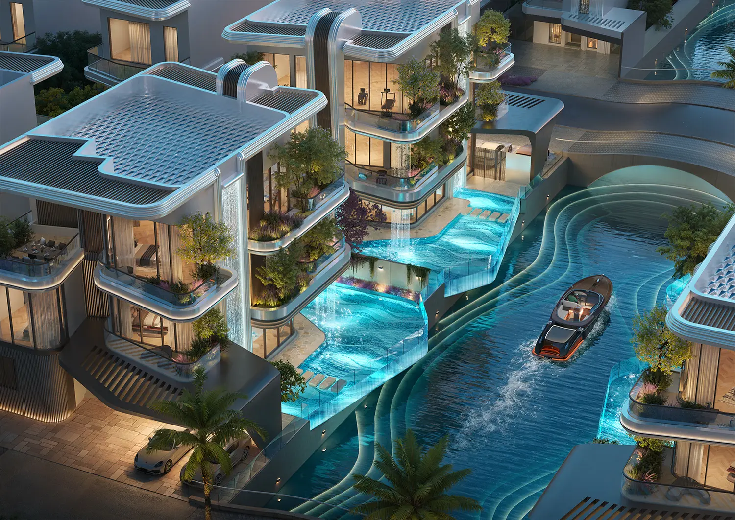LEOS Royal — official night aerial of canal-front villas with waterfall facades and a boat on the water