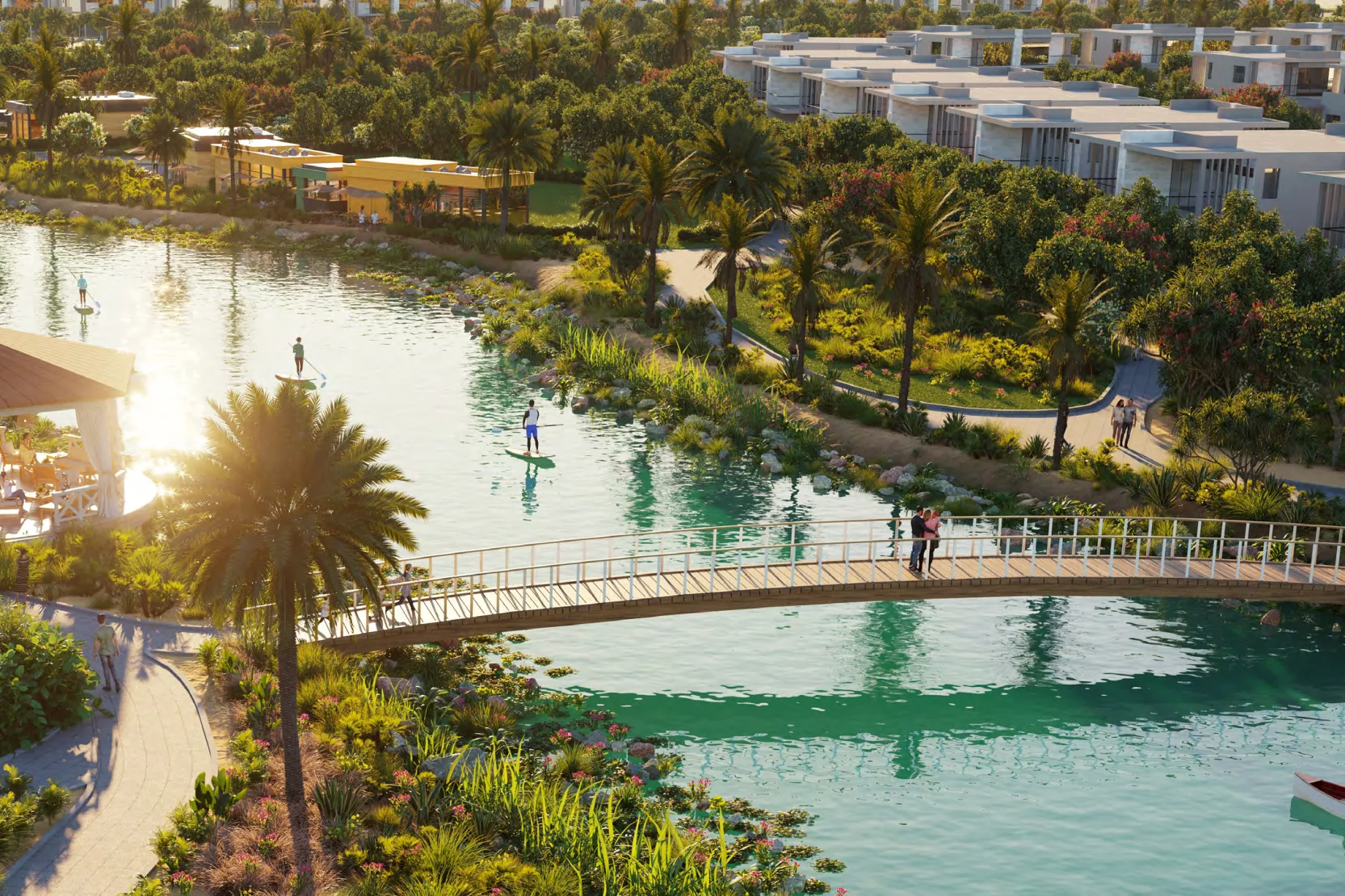 DAMAC Hills 2 Water Town marketing still — lagoon, footbridge and townhouse rows (community amenity, not a Natura plot)