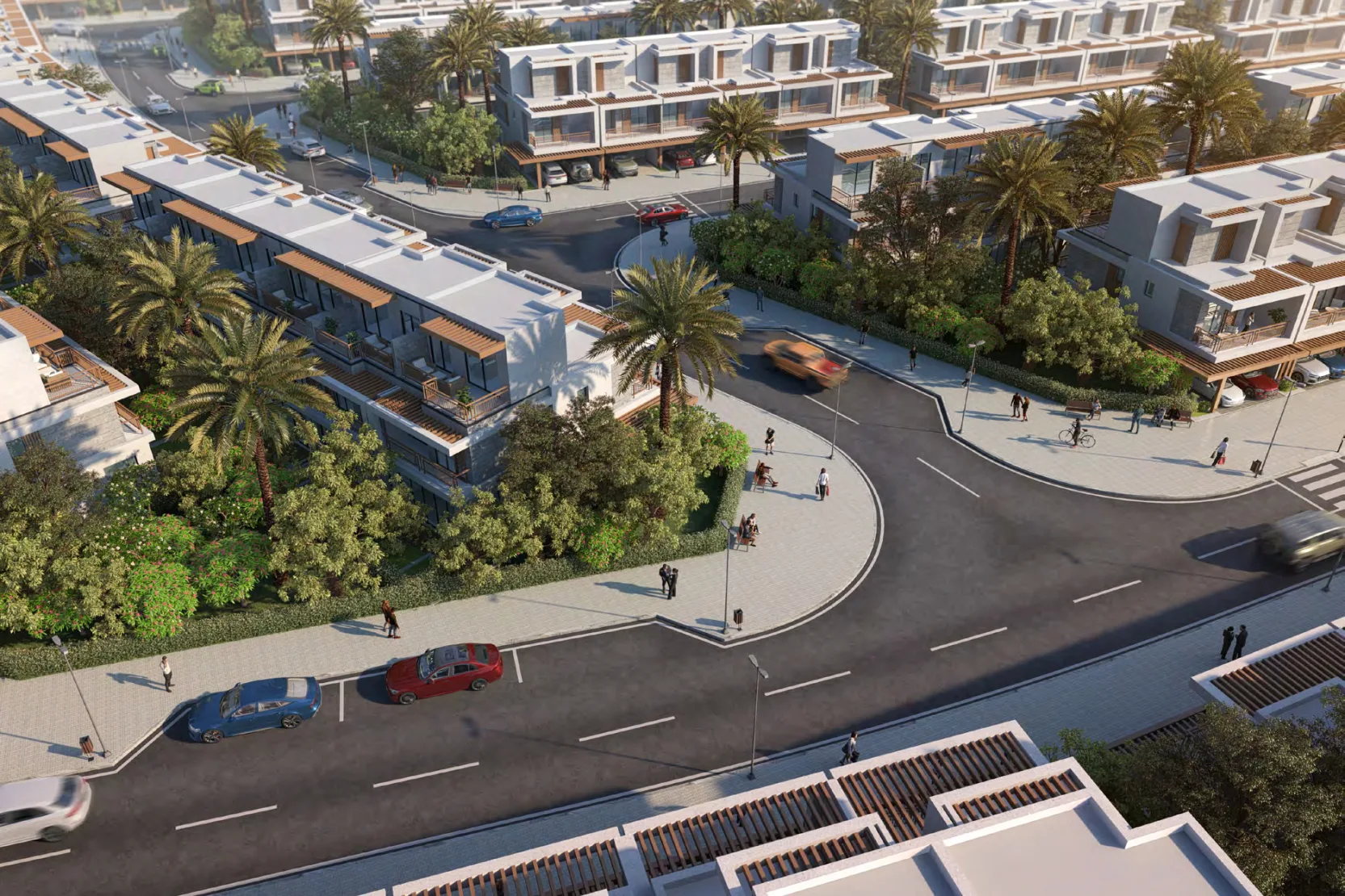 Natura street aerial — marketing still of the white townhouse rows around a landscaped roundabout