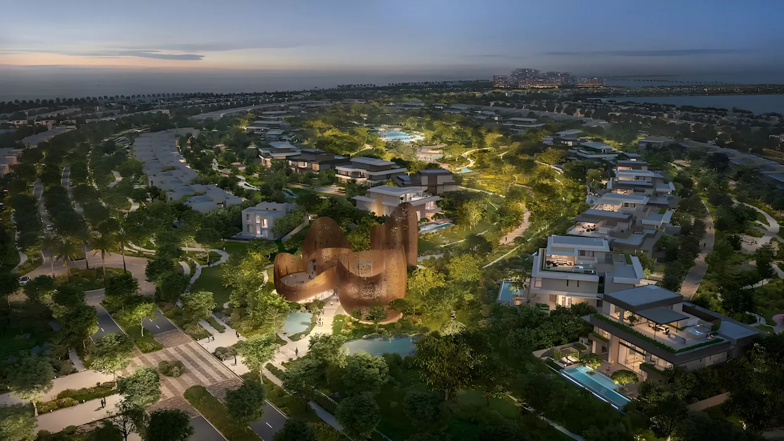 The Wilds by Aldar — dusk aerial of the Nest pavilion and villa streets (master-community context)