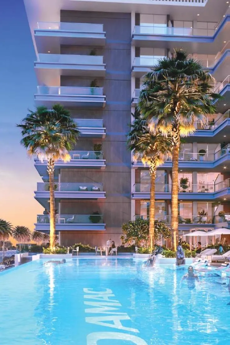 Damac Riverside Views Capri — pool terrace evening marketing render with DAMAC pool branding