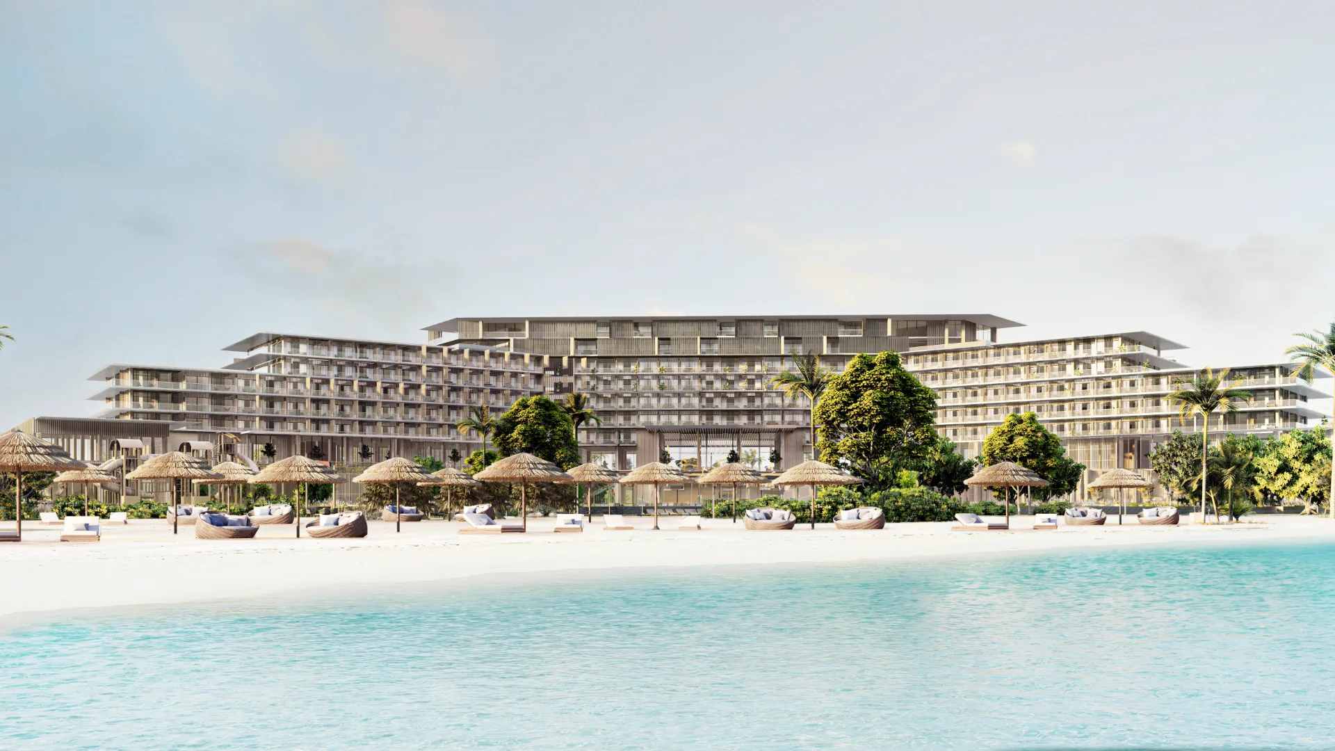 Rixos Dubai Islands Hotel & Residences — official Nakheel beachfront still of the longer resort building behind umbrellas (parent cove, not a titled flat)