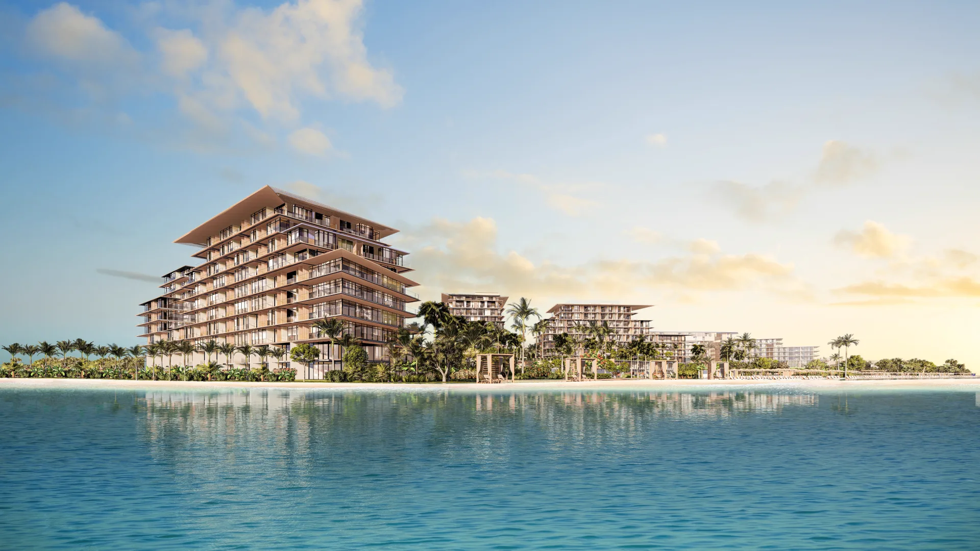Rixos Dubai Islands Beach Residences — official Nakheel water-level still of a stacked-terrace apartment block on the cove