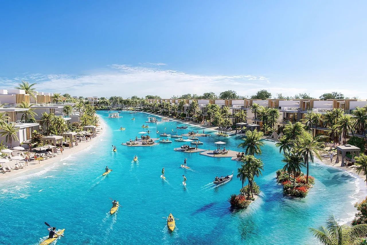 DAMAC Islands parent — marketing still of white villa clusters around a landscaped lagoon