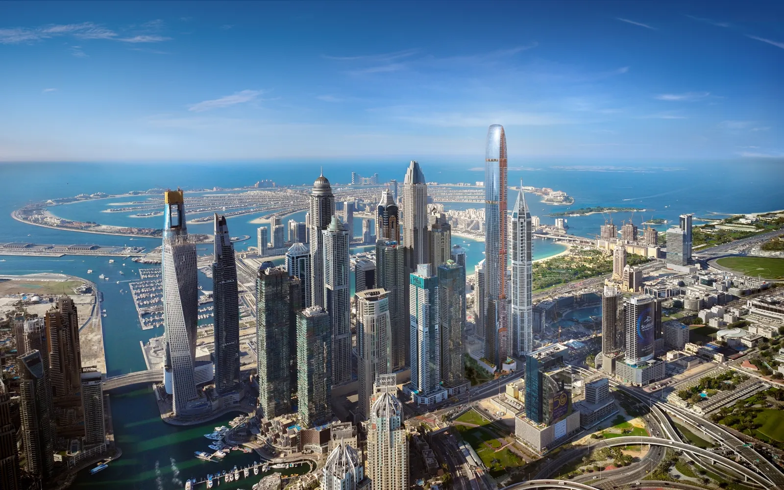 Six Senses Residences Dubai Marina — aerial masterplan marketing still placing the tower in the Dubai Marina cluster with Palm Jumeirah beyond