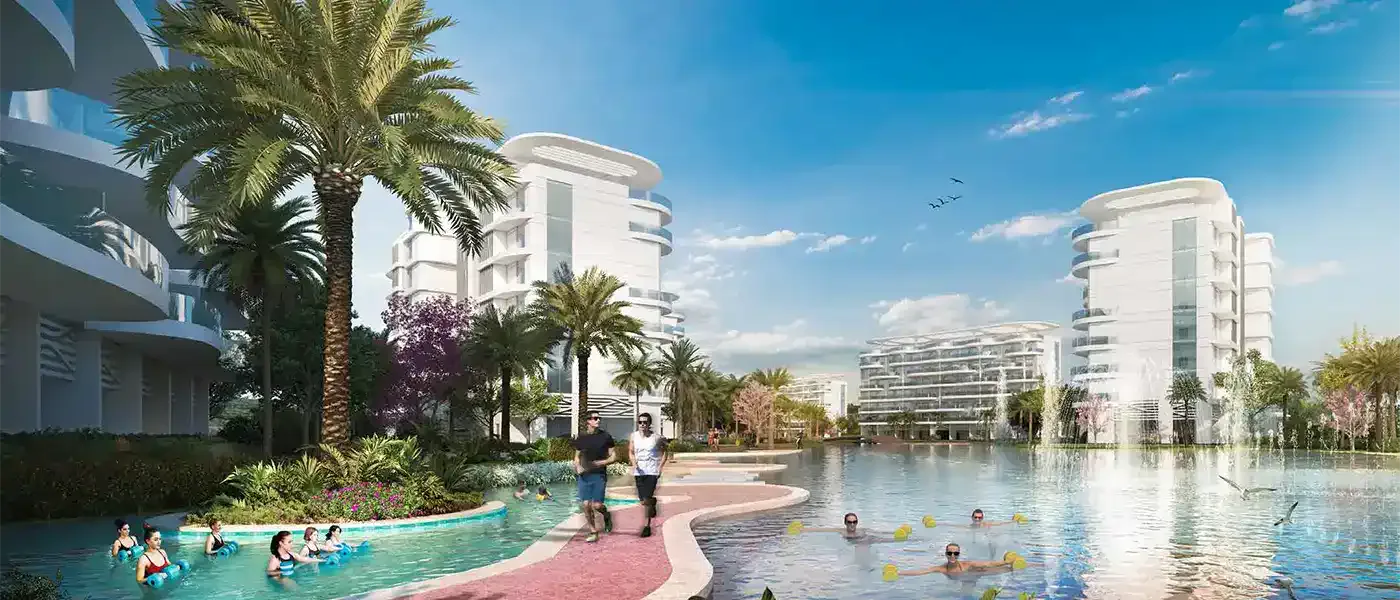 Sorrento at DAMAC Lagoons — broker marketing still of white mid-rise apartment towers around a lagoon pool