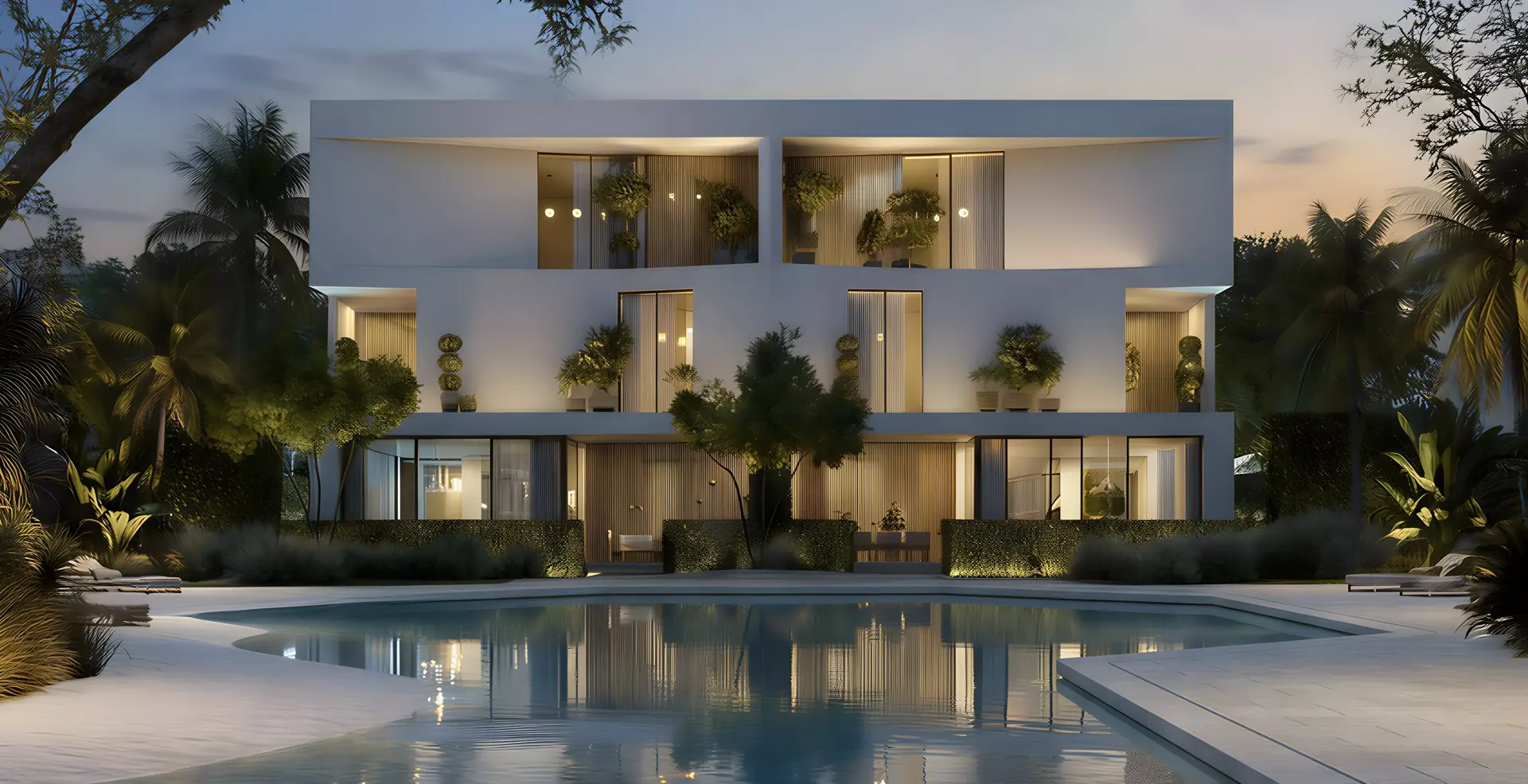 The Dune at Lunaya — night marketing exterior of the same garden-facing duet with pool