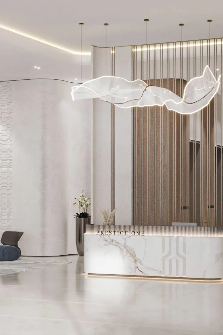 The Place by Prestige One — lobby desk marketing still with PRESTIGE ONE lettering
