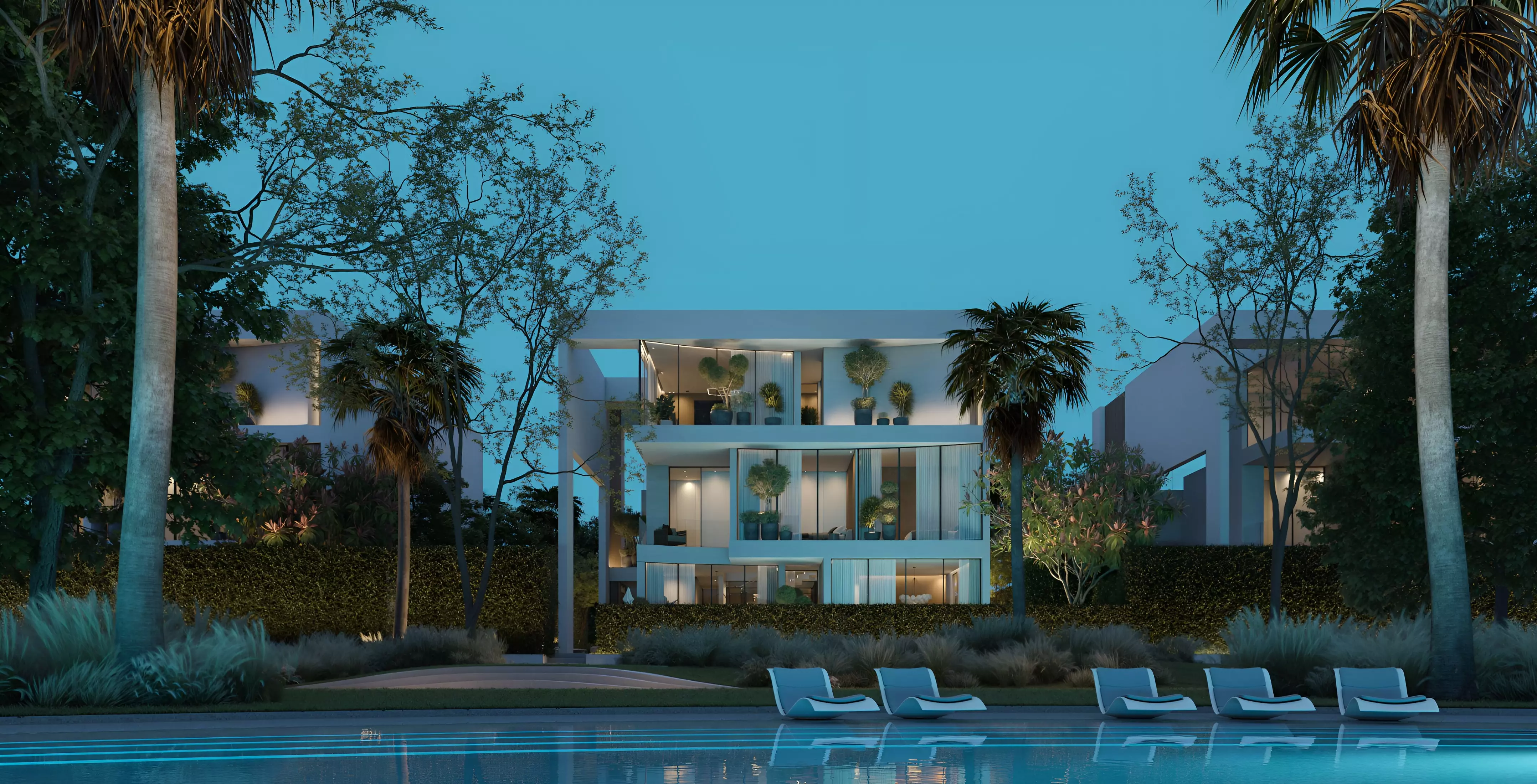 The Sol at Lunaya — wide marketing exterior of white residential villa collection along lagoon / landscaped edge