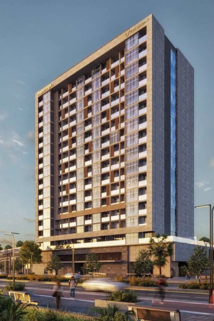 Verdana X by Reportage — street facade of the apartment tower with Reportage and VERDANA X crown lettering