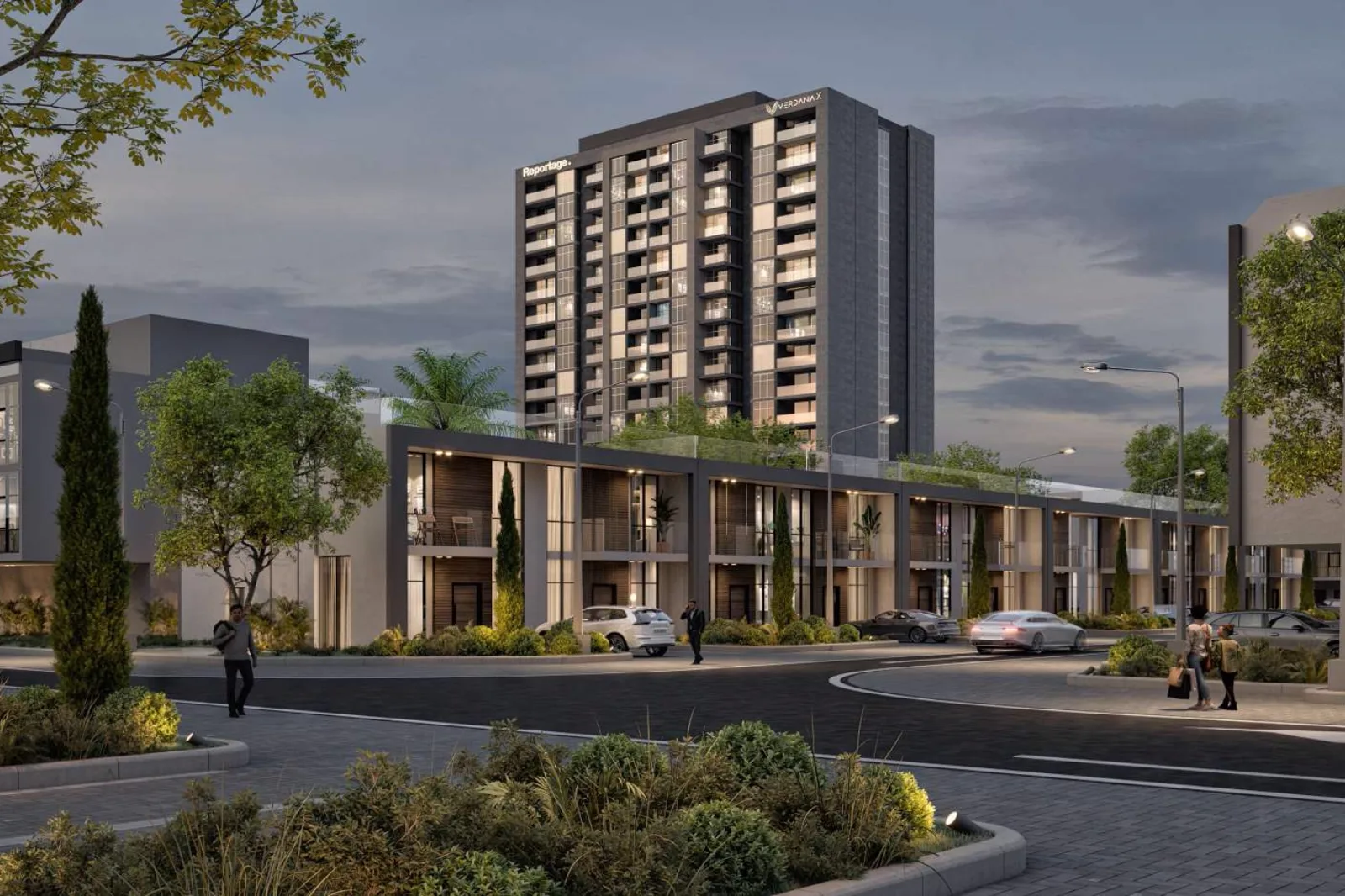 Verdana X by Reportage — dusk street of courtyard townhouses with the lettered apartment tower behind